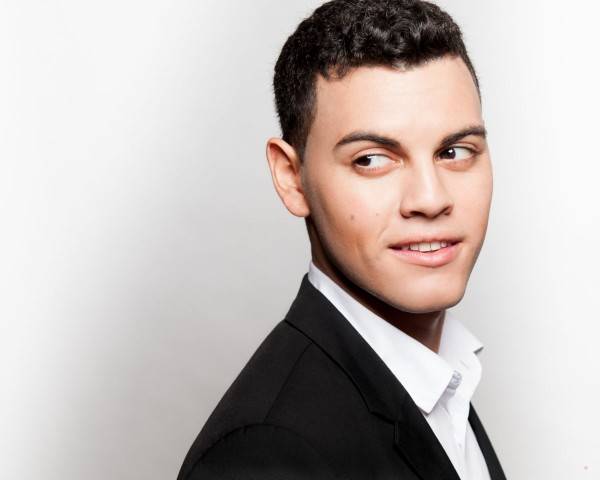 headshot of a young man in a suit