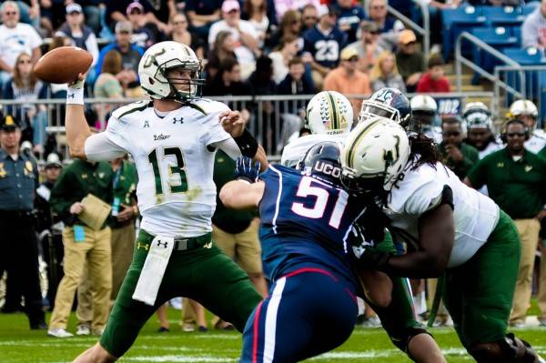 USF Football USF quarterback throwing a pass