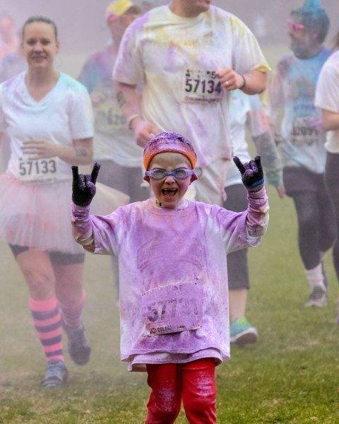 Color Me Rad Picture of boy running in a 5k race