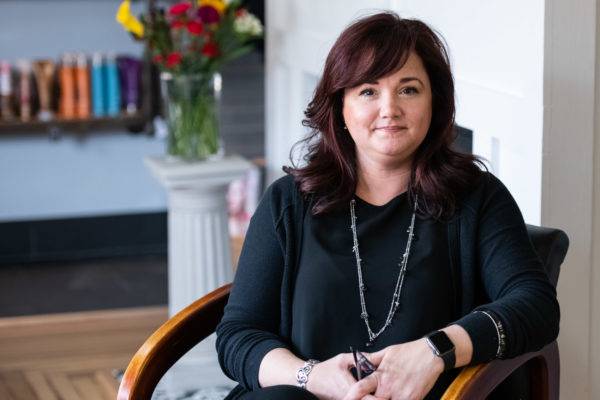 Portrait of a professional woman sitting in a chair